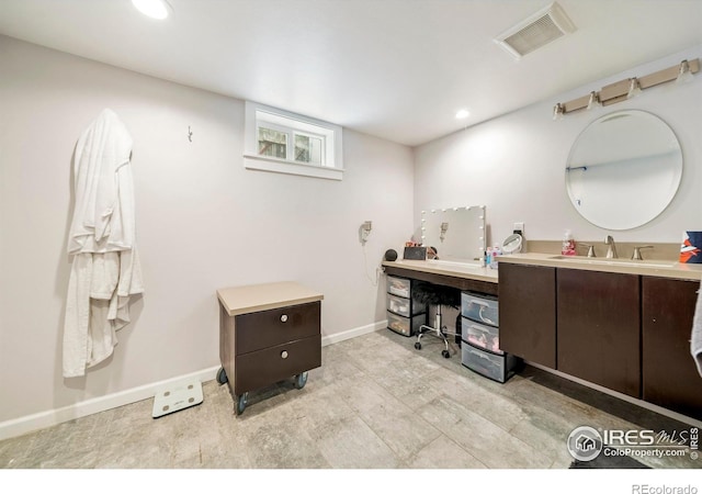 614 E Beaver Ave, Fort Morgan, CO 80701 - full bathroom featuring vanity, baseboards, and recessed lighting