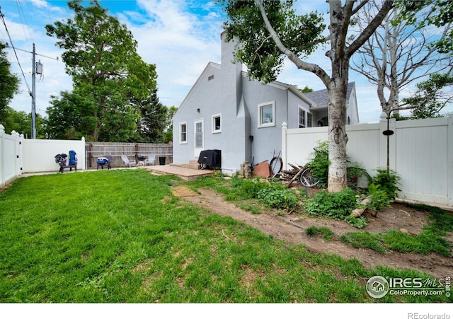 614 E Beaver Ave, Fort Morgan, CO 80701 - view of yard with a patio area