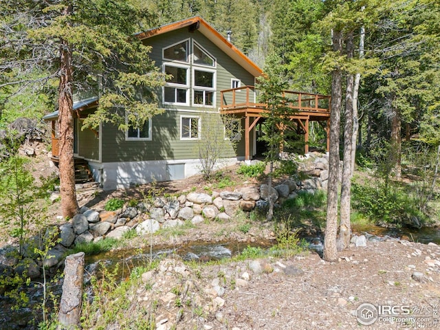 90 California Gulch Rd, Jamestown, CO 80455 - back of house with a deck and a view of trees