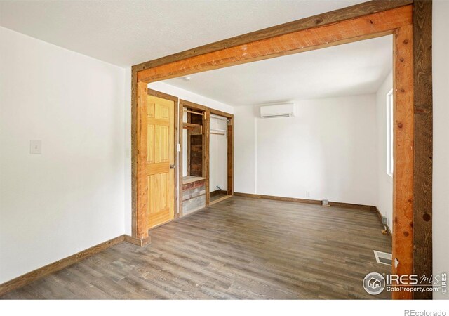 90 California Gulch Rd, Jamestown, CO 80455 - unfurnished room featuring a wall mounted AC and wood finished floors