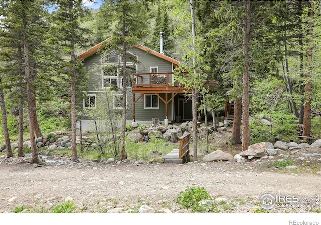 90 California Gulch Rd, Jamestown, CO 80455 - rear view of property with a deck and a wooded view