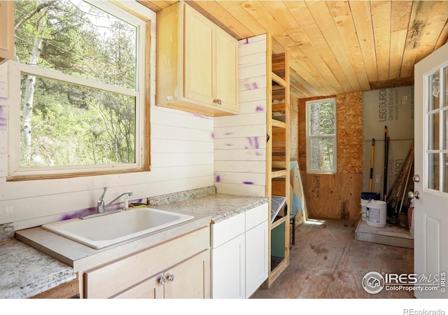 90 California Gulch Rd, Jamestown, CO 80455 - kitchen with wood ceiling, a sink, light countertops, wooden walls, and light wood-style flooring