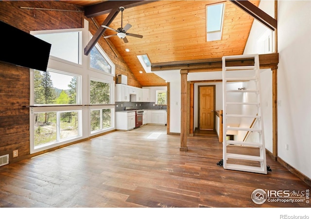 90 California Gulch Rd, Jamestown, CO 80455 - unfurnished living room featuring high vaulted ceiling, a skylight, light wood-type flooring, ceiling fan, and a wooden ceiling with exposed beams