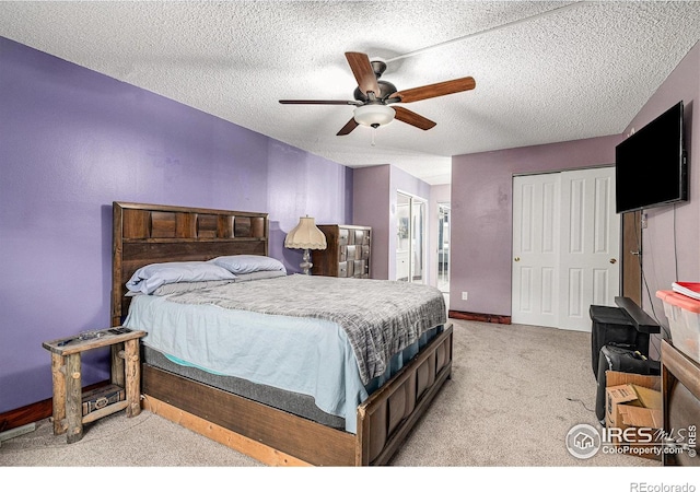 14000 E Linvale Pl Unit 210, Aurora, CO 80014 - bedroom with light carpet, a textured ceiling, ceiling fan, and ensuite bath