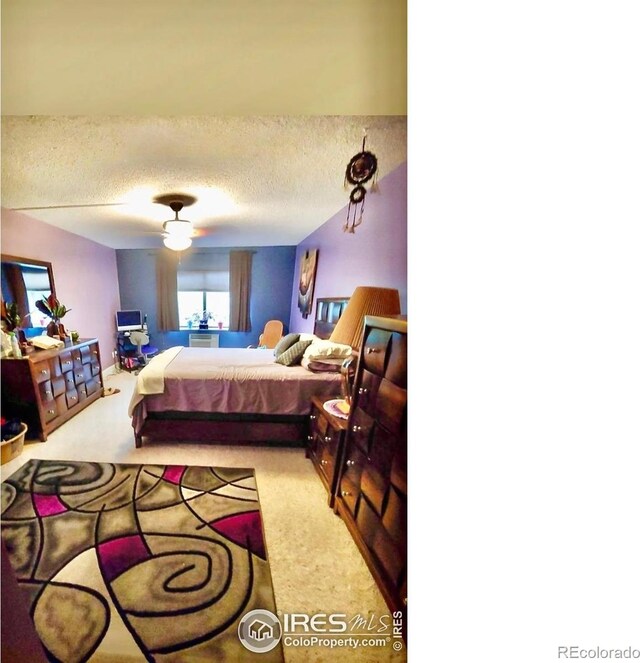 14000 E Linvale Pl Unit 210, Aurora, CO 80014 - bedroom with a textured ceiling, carpet flooring, and a ceiling fan