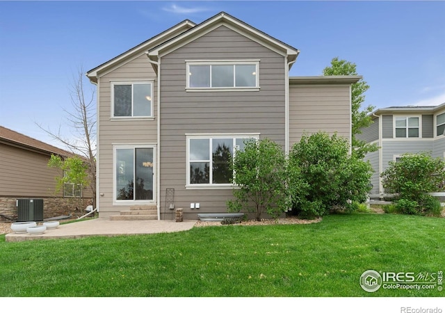 17805 Coral Burst St, Parker, CO 80134 - back of house with a patio, a lawn, cooling unit, and entry steps