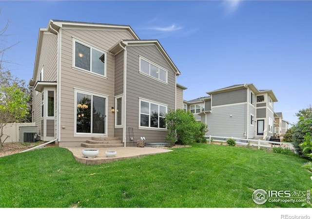 17805 Coral Burst St, Parker, CO 80134 - rear view of house with entry steps, central air condition unit, and a patio area