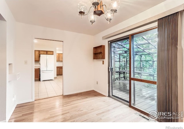 1025 Edinboro Dr, Boulder, CO 80305 - spare room with a chandelier, light wood finished floors, and baseboards