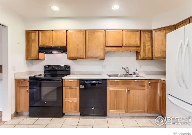 1025 Edinboro Dr, Boulder, CO 80305 - kitchen featuring black appliances, a sink, under cabinet range hood, brown cabinetry, and recessed lighting