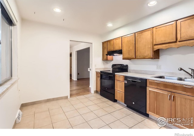 1025 Edinboro Dr, Boulder, CO 80305 - kitchen featuring black appliances, under cabinet range hood, a sink, light countertops, and recessed lighting