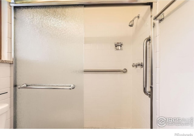 1025 Edinboro Dr, Boulder, CO 80305 - bathroom featuring a shower stall and toilet