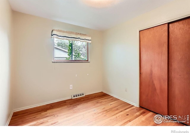 1025 Edinboro Dr, Boulder, CO 80305 - unfurnished bedroom featuring light wood finished floors, a closet, and baseboards