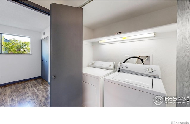 3526 S Depew St Unit 102, Lakewood, CO 80235 - laundry room with washing machine and clothes dryer and wood finished floors