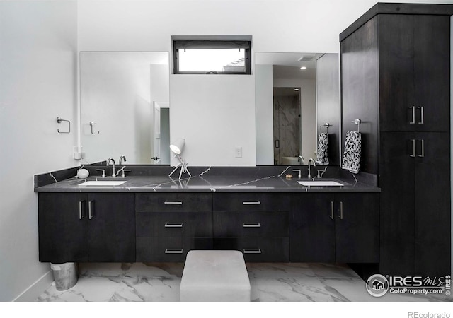 1769 Beachside Dr, Windsor, CO 80550 - full bath with marble finish floors, double vanity, and baseboards