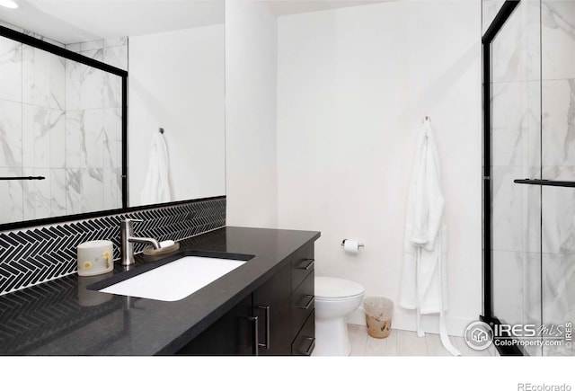 1769 Beachside Dr, Windsor, CO 80550 - bathroom with vanity, a stall shower, toilet, and tile patterned flooring