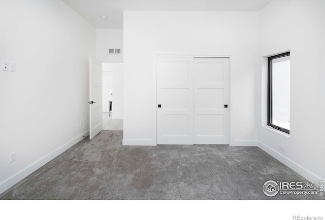 1769 Beachside Dr, Windsor, CO 80550 - unfurnished bedroom featuring carpet floors, a closet, and baseboards