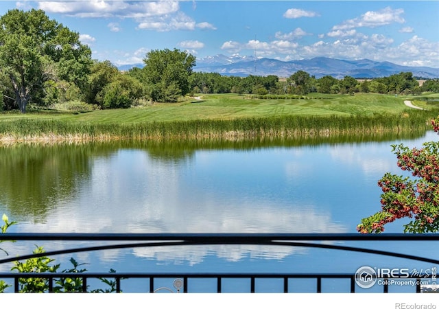 1769 Beachside Dr, Windsor, CO 80550 - water view with a mountain backdrop and a tree filled landscape