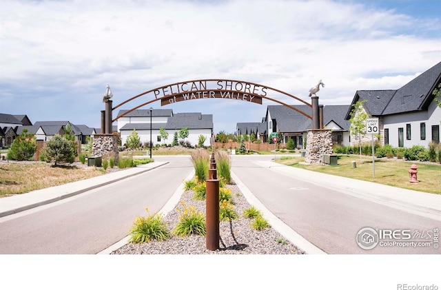 1769 Beachside Dr, Windsor, CO 80550 - view of asphalt road featuring traffic signs and a residential view