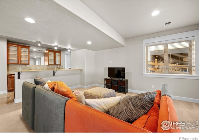 2005 Calico Ct, Longmont, CO 80503 - living area with light colored carpet, baseboards, and recessed lighting