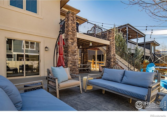 2005 Calico Ct, Longmont, CO 80503 - view of patio featuring a balcony and an outdoor hangout area