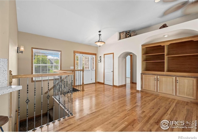 29 Pioneer Pl, Eaton, CO 80615 - living area with light wood-type flooring and arched walkways