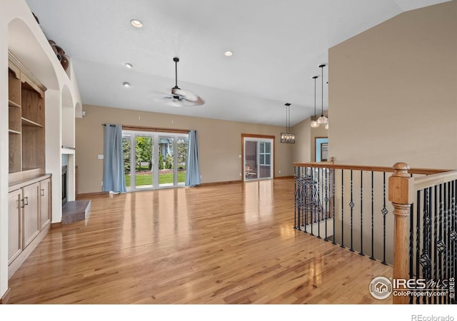 29 Pioneer Pl, Eaton, CO 80615 - unfurnished living room featuring vaulted ceiling, a ceiling fan, light wood-style floors, and recessed lighting