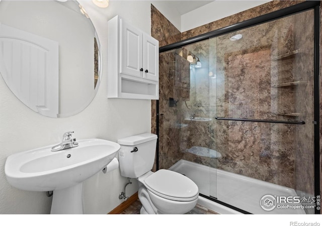 29 Pioneer Pl, Eaton, CO 80615 - bathroom featuring toilet, a stall shower, and a sink