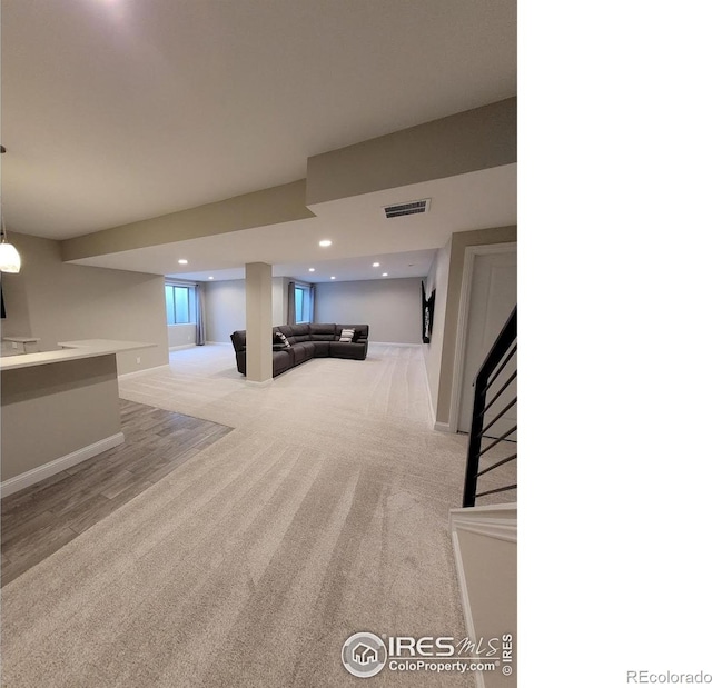 4236 Carroway Seed Ct, Johnstown, CO 80534 - below grade area featuring light carpet, baseboards, and recessed lighting