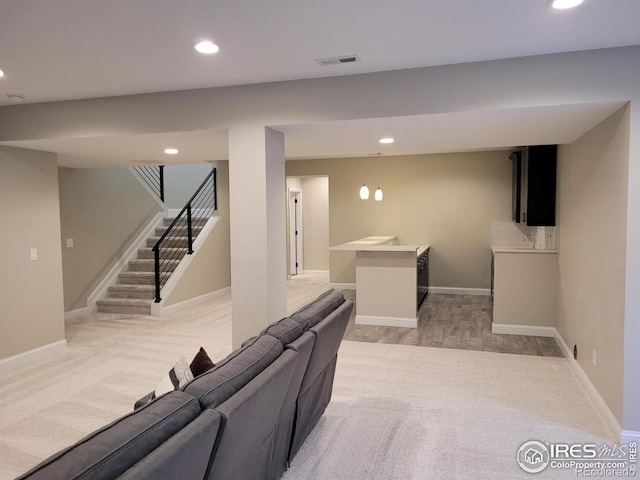 4236 Carroway Seed Ct, Johnstown, CO 80534 - finished below grade area with recessed lighting, stairs, light carpet, and baseboards