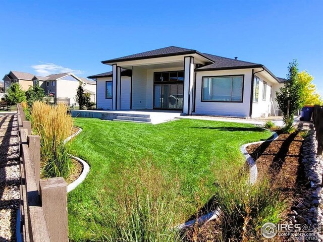 4236 Carroway Seed Ct, Johnstown, CO 80534 - back of house featuring a yard