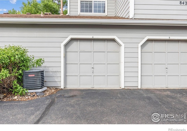 8423 Everett Way Unit A, Arvada, CO 80005 - garage featuring central air condition unit
