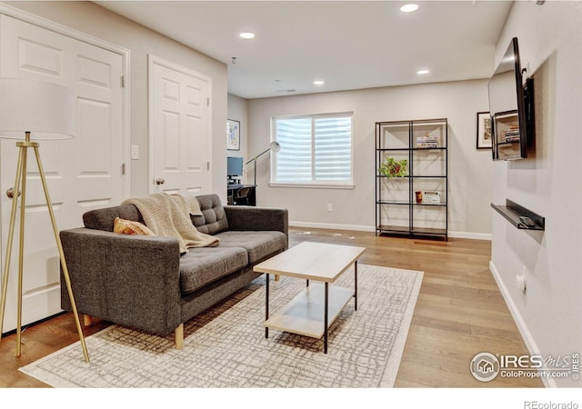 1240 Wren Ct Unit D, Longmont, CO 80501 - living room with light wood-style floors, baseboards, and recessed lighting