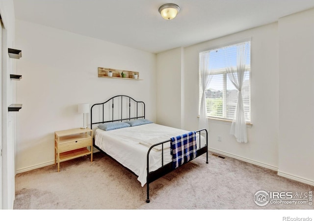 1240 Wren Ct Unit D, Longmont, CO 80501 - bedroom featuring carpet flooring and baseboards