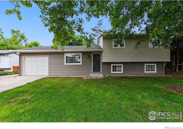 4329 Main St, Timnath, CO 80547 - tri-level home with concrete driveway, a garage, and a front yard
