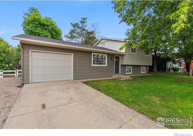 4329 Main St, Timnath, CO 80547 - tri-level home with concrete driveway and an attached garage
