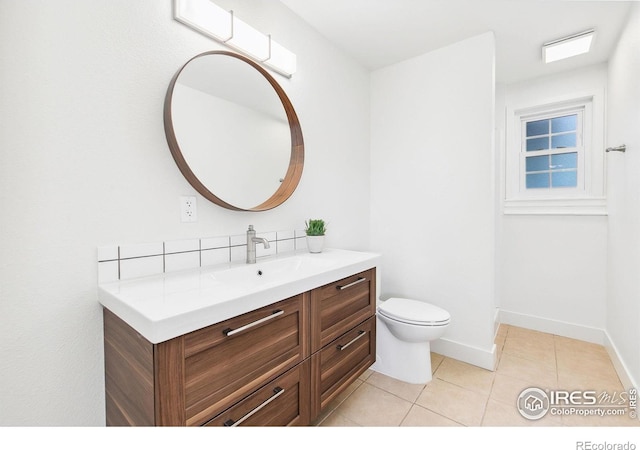 4329 Main St, Timnath, CO 80547 - bathroom featuring vanity, tile patterned floors, toilet, and baseboards