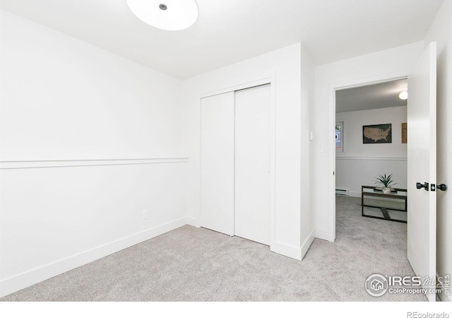 4329 Main St, Timnath, CO 80547 - unfurnished bedroom with carpet flooring, a baseboard heating unit, a closet, and baseboards