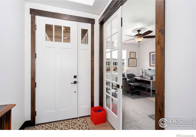 4521 Devereux Dr, Windsor, CO 80550 - entrance foyer with a ceiling fan and carpet