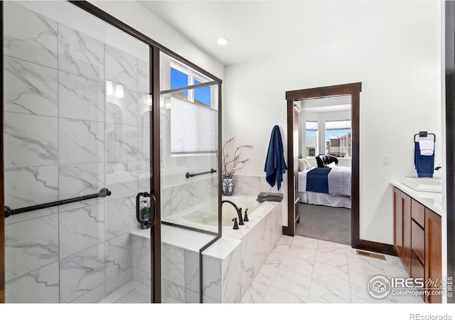 4521 Devereux Dr, Windsor, CO 80550 - ensuite bathroom with marble finish floors, a bath, vanity, and a marble finish shower