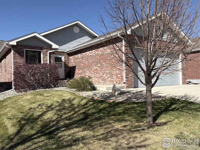 2126 Friar Tuck Ct, Fort Collins, CO 80524 - single story home featuring driveway, a front yard, brick siding, and an attached garage