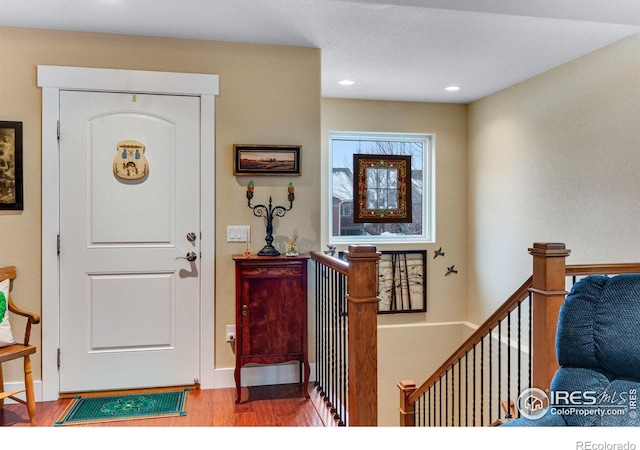 2126 Friar Tuck Ct, Fort Collins, CO 80524 - foyer with wood finished floors, recessed lighting, and baseboards