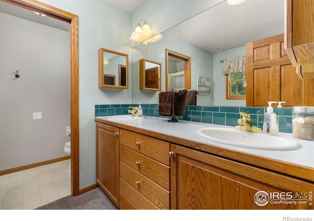 806 51st Ave, Greeley, CO 80634 - bathroom with double vanity and tile patterned floors