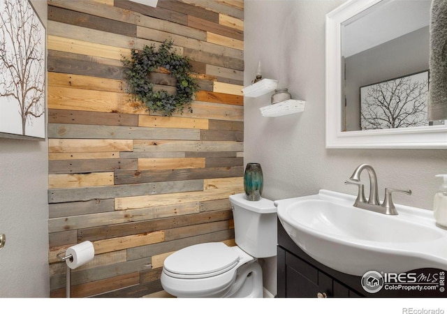 806 51st Ave, Greeley, CO 80634 - bathroom with wooden walls and vanity