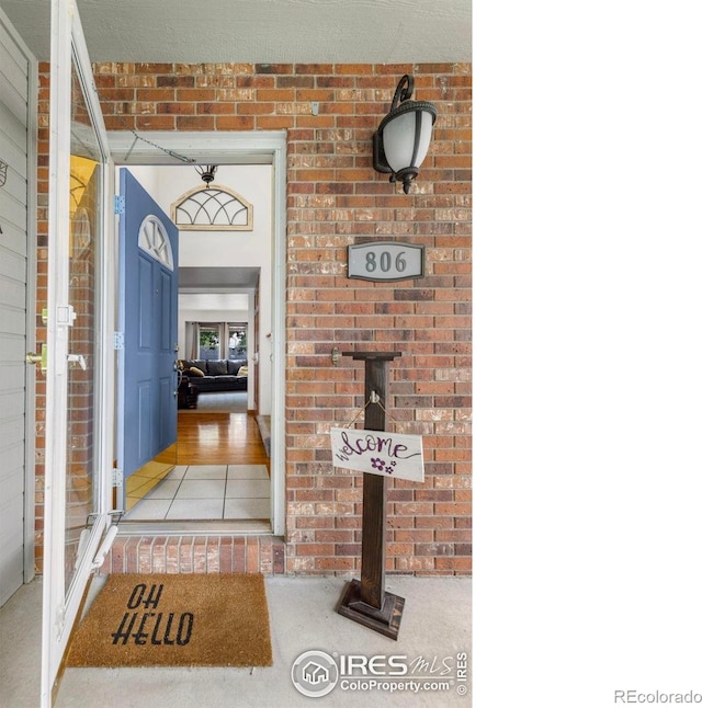 806 51st Ave, Greeley, CO 80634 - doorway to property with brick siding