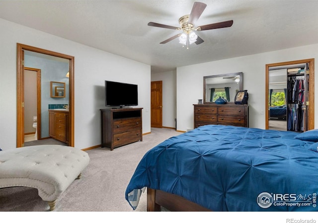 806 51st Ave, Greeley, CO 80634 - bedroom with carpet, a ceiling fan, ensuite bathroom, and a walk in closet