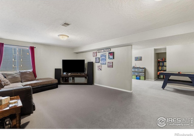 806 51st Ave, Greeley, CO 80634 - carpeted living room featuring a textured ceiling