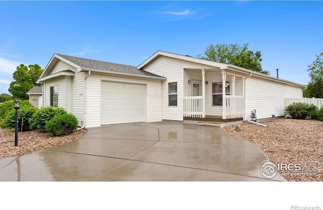 856 Sunchase Dr, Fort Collins, CO 80524 - ranch-style home with covered porch, an attached garage, and driveway
