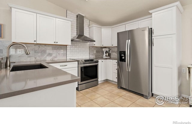 856 Sunchase Dr, Fort Collins, CO 80524 - kitchen with stainless steel appliances, wall chimney range hood, a sink, backsplash, and light tile patterned floors