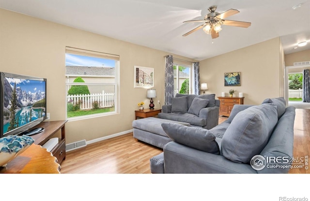856 Sunchase Dr, Fort Collins, CO 80524 - living room featuring wood finished floors, lofted ceiling, ceiling fan, and baseboards