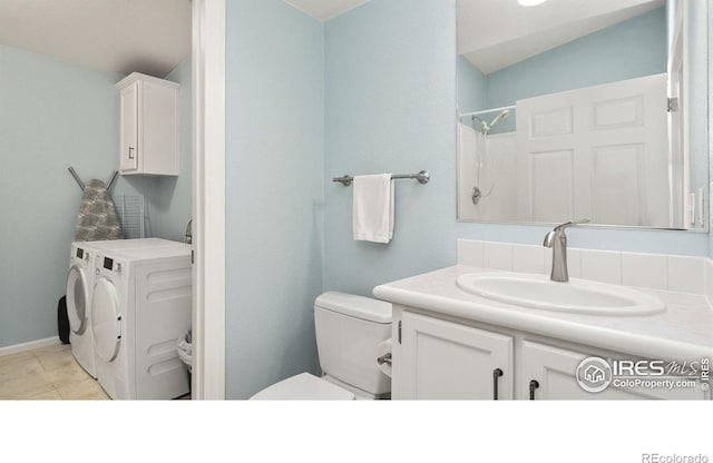 856 Sunchase Dr, Fort Collins, CO 80524 - full bath featuring independent washer and dryer, toilet, vanity, and tile patterned floors